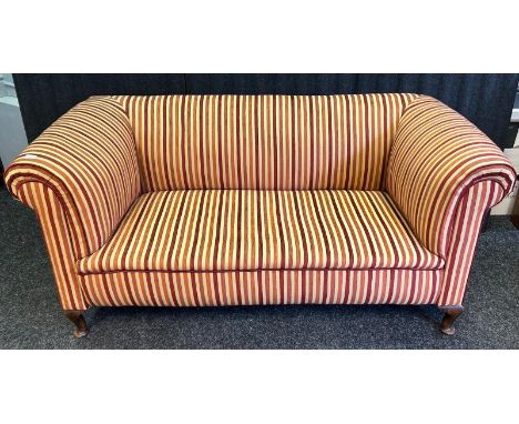 A 19th Century settee, the high back and sides above a sprung and straw filled seat raised on short cabriole legs, the whole 