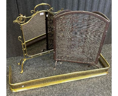 A reproduction brass mirror fire screen together with a metal mesh and leaf design fire screen, brass fire fender and a raise