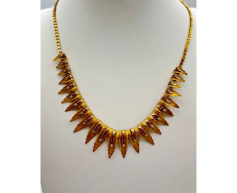 18ct Gold and ruby necklace, circa 1940 formed with graduated gold drops set with circular cut rubies, on a fancy link chain 