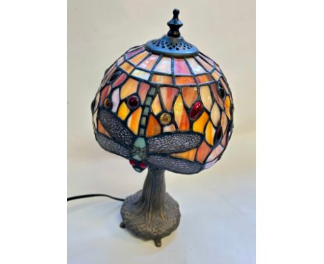 A Tiffany style table brass lamp with Dragonfly stained glass design.