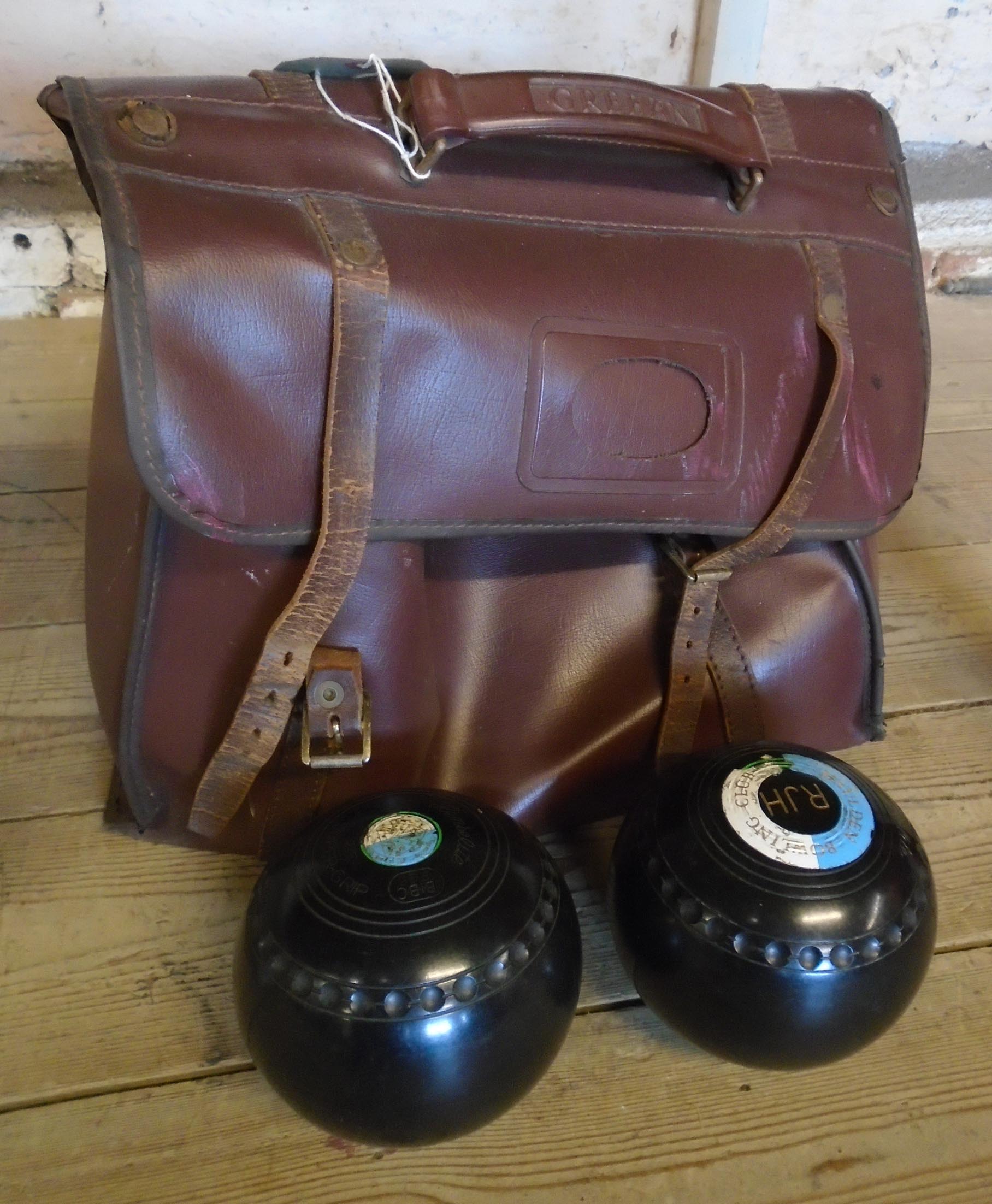 A set of four lawn bowls in bag