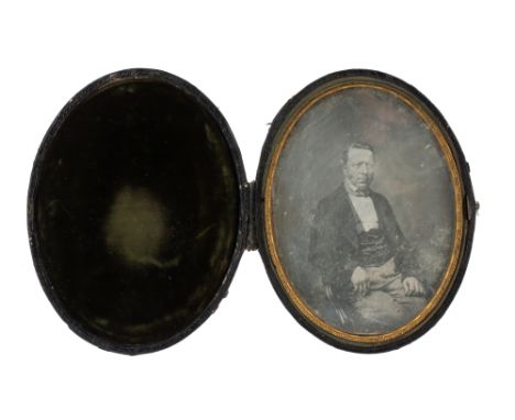A Large Cased Oval Daguerreotype Portrait, English, c.1860, portrait of a seated gentleman, in a green velvet-lined oval case