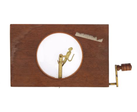 A Rare Dancing Monkey Magic Lantern Slide, with a brass plate monkey on a pivot with a pully wheel connected to the winding h