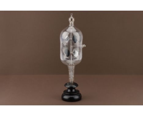 A Double Vane Crooke's Radiometer German, c.1880, hand blown glass vessel containing 2 sets of mica vanes constructed to cont