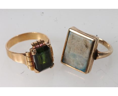 9ct gold square fronted ladies dress ring set with central marbled blue coloured stone, size K, 4.1g and a yellow gold dress 