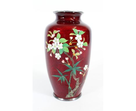Japanese Ginbari cloisonne enamel vase, late Meiji, decorated with polychrome blossom tree on a dimpled red ground, H18.5cm.