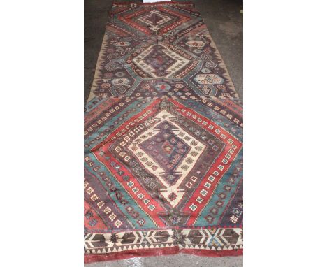 19th century Anatolian Kelim runner, , the twin section of three geometrical lozenges, 1.46m x 3.94m.