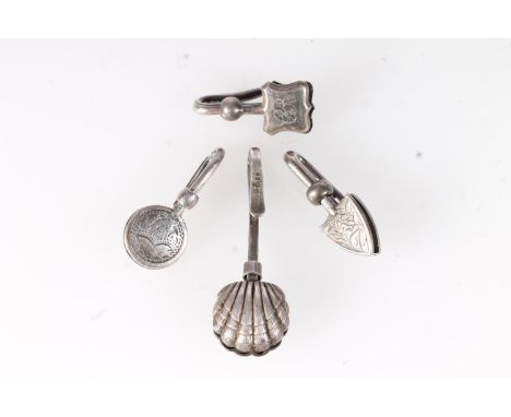 Four silver skirt lifters, various makers including W H Collins &amp; Co, Adie &amp; Lovekin Ltd, GRW and CCP. (4)