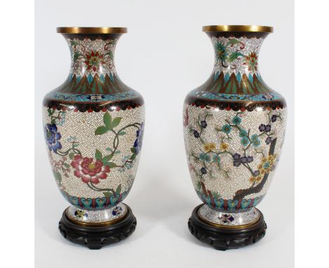 Pair of Chinese Cloisonne enamel vases, Republic period, the baluster shape bodies decorated with foliate themes on a fretwor