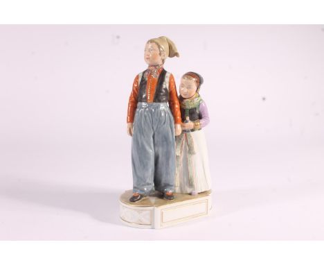 Royal Copenhagen Amager figural group 'Cornelis og Elispeth', of a boy and girl with doll, in traditional costume, H22cm. CR 