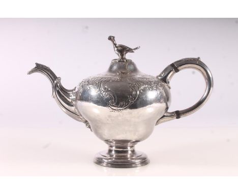 Geo. III silver teapot, of rococo form, the domed cover with later attached phoenix finial, the body with foliate scroll chas