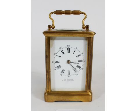 French gilt metal carriage clock, late 19th century, of typical Obis case form with visible movement, the white enamel dial w