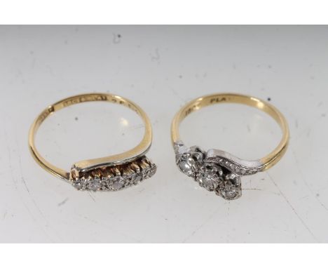 18ct yellow gold and platinum three stone diamond crossover ring, size K, and a 18ct gold and platinum five stone diamond cro