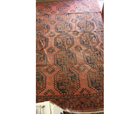Ersari/Afghan carpet, the rust ground with three rows of guls, 3.32m x 2.32m.