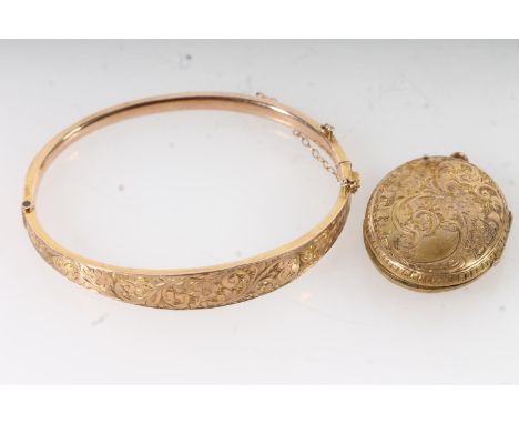 9ct yellow gold foliate decorated snap shut bangle, interior 6cm wide, 5.98g and a yellow metal Victorian picture locket, (2)