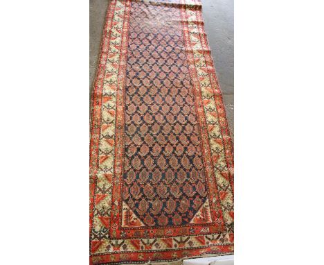Hamadan runner, the indigo field with repeated boteh ornament &amp; shades of powder blue, red and gold with lesser animal an
