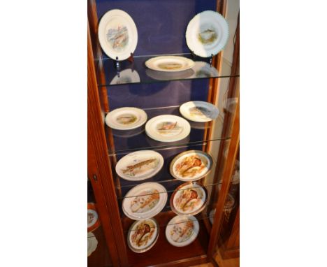 A quantity of Wood & Sons and Wilkinson fish related picture plates, together with a quantity of game related serving plates 