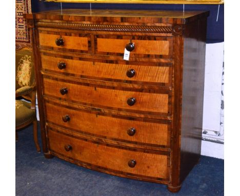 A 19th century Scotch mahogany and satinwood bow front chest, the crossbanded top with lobe corners over rope twist frieze, t