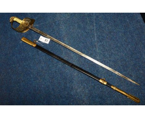 A replica RAF officers sword, with brass eagle mask surmount, faux shagreen grip, pierced brass hilt with crests, etched foli