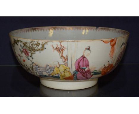 A late 19th century Chinese export punch bowl, decorated with polychrome enamel figures in foliage, ending in circular foot (