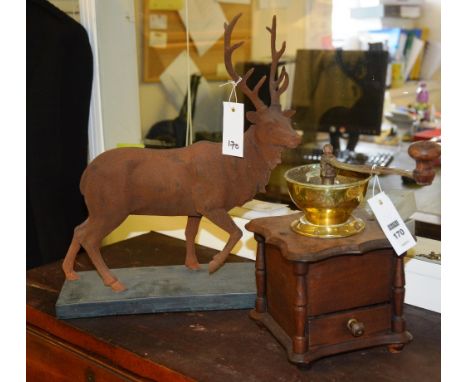 A vintage coffee grinder, with revolving handle, brass bowl, raised on wooden stand, 27cm high, together with a figure of a s