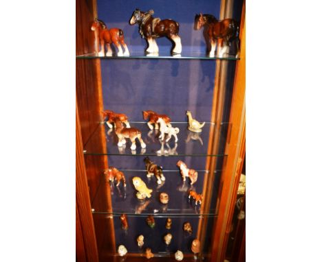 A quantity of ceramic animal figures, to include Beswick owl figure and horses