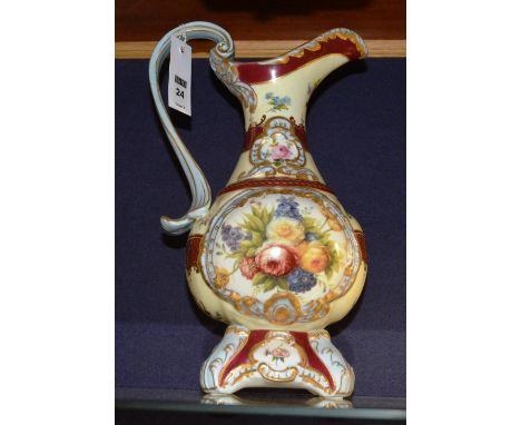 A Vienna style ceramic toilet ewer, decorated with foliate panels within a cream ground, stamped Rettier to base, 36cm high