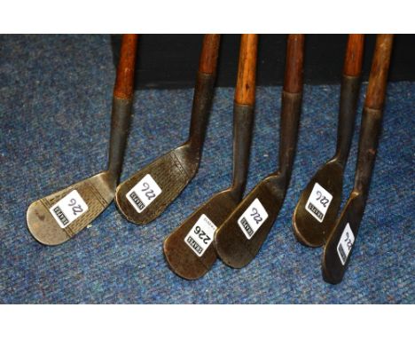 Six vintage hickory shafted 'Mashie' golf clubs, comprising of driving Mashie by AH Scott, 98cm long, Deep Face Mashie by C N
