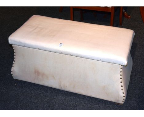 An Ottoman, the cushioned hinged rectangular lid over ogee trunk on broad feet, 97cm wide x 44cm high x 49cm deep