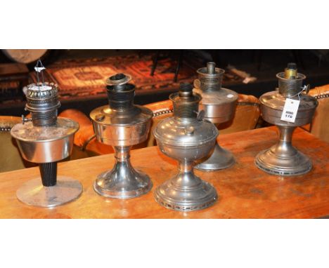 Five vintage paraffin lamps, lacking glass funnels, 31cm high (5)