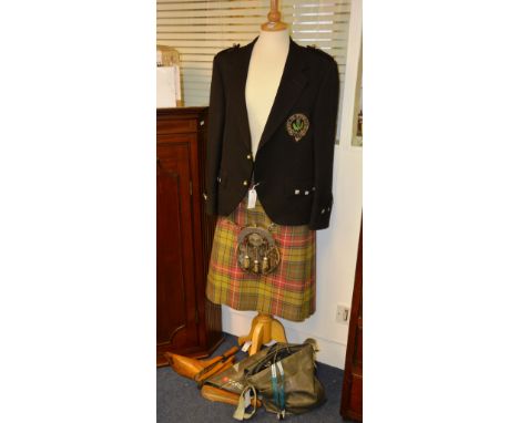 A dress kilt outfit, comprising of black jacket with order of the thistle badge, unmarked silver buttons, tartan kilt 34'' wa