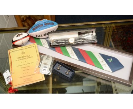 A quantity of rugby memorabilia, comprising of a signed framed Scottish Wooden Spoon Rugby Tie, signed by Gordon Brown, Ian M