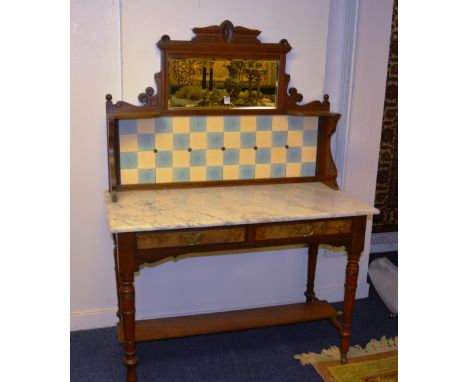 An Edwardian mahogany and walnut washstand, the shaped gallery fitted with mirror and tiles, over rectangular marble top, two