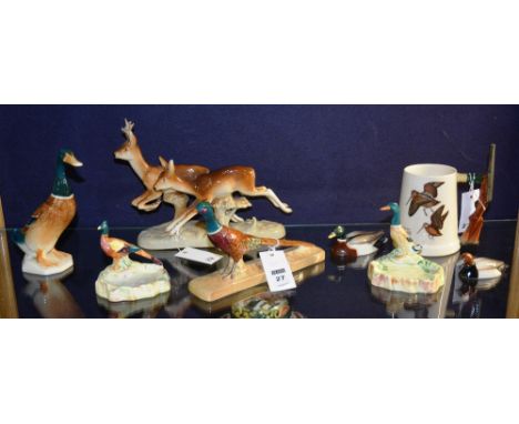 Six Beswick animal ornaments, in the form of pheasants and mallard ducks, various sizes, together with a Goss hunting tankard