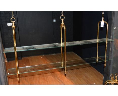 Two sets of brass effect hanging shelves, with hanging chains and glass shelves (one shelf lacking) 140cm long (2)