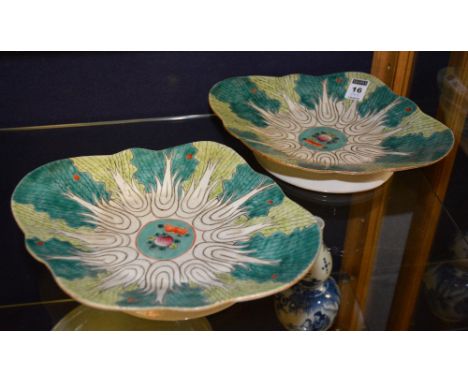 A pair of Chinese scallop shaped dishes, with green and white enamel decoration, orange character marks to base, 28cm diamete