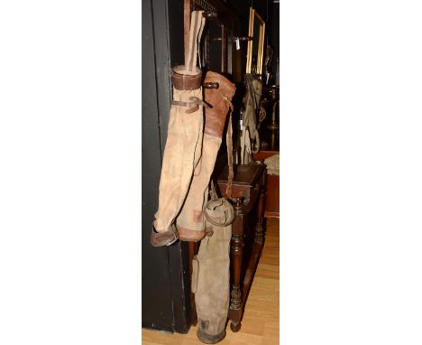 Five vintage canvas golf bags, 74cm long CONDITION REPORT: Lot 230 - Bags not in great condition, tears and damage to all.
