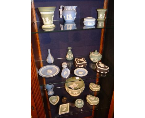 A quantity of Wedgwood Jasperware ornaments, to include green and blue vases, jugs and trinket boxes, together with two black