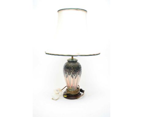 Moorcroft table lamp, on stepped circular base, 63.5cms high including shade.