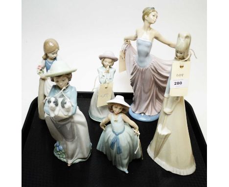Lladro figure of a dancer, modelled with arms outstretched, 30cms high; along with a Lladro figure of a girl, three Nao figur