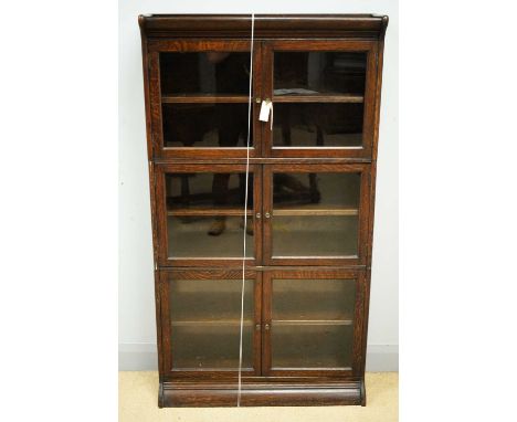 An early 20th Century oak Globe Wernicke style stacking bookcase, the projecting cornice above three pairs of glazed cupboard