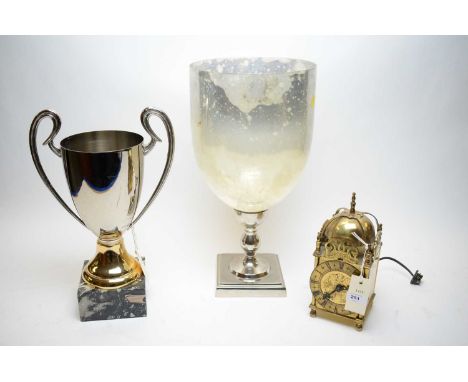 Brass lantern clock, 24cms high; two-handled trophy cup, on square base with presentation label; and a modern glass goblet, o