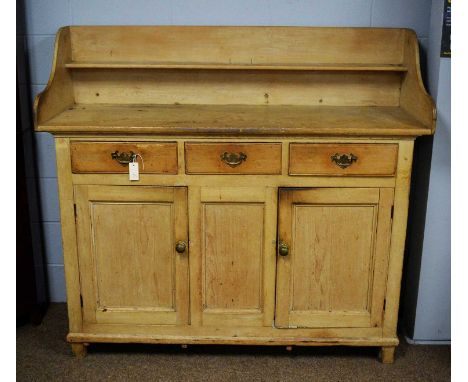  Early 20th century Pine sideboard with 3/4 gallery and single shelf above a rectangular top, three frieze drawers and two pa