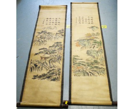 Pair of Chinese scroll paintings, each with a panel of script over a mountainous landscape scene, 35cms wide (each 44cms wide