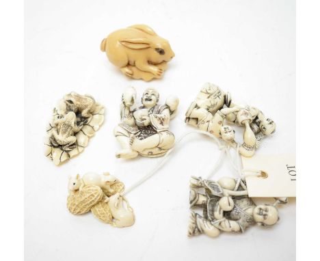 Three Japanese figural netsuke; along with a Japanese netsuke of three rats, a Japanese netsuke of two toads and a rabbit net