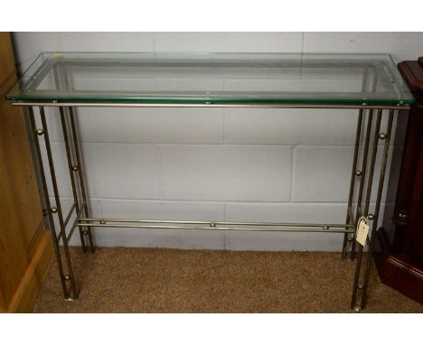 A 20th Century glass and aluminium console table, the rectangular top above line and ball decorated metal legs united by a si