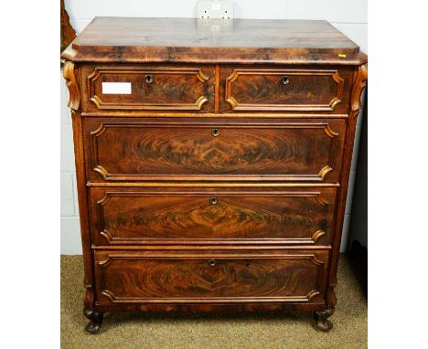 A 19th Century mahogany Biedermeier style chest of drawers, the shaped caddy top with canted angles above an arrangement of t