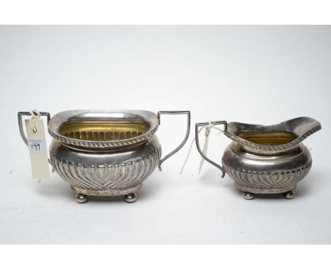 A silver milk jug and two-handled sugar bowl, by Joseph Gloster, Birmingham 1910, of harp reeded design, 13oz gross. 