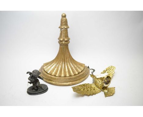 Brass light fitting modelled as an eagle, wingspan 35cms wide; along with a bronzed figure of a cherub and a gilt wall sconce