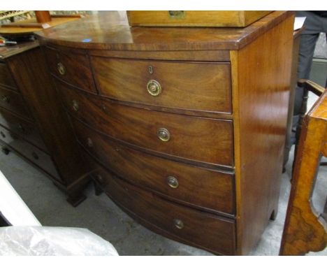 A George III mahogany bow fronted, five drawer dressing chest, raised on bracket feet, 42 h, 41 w